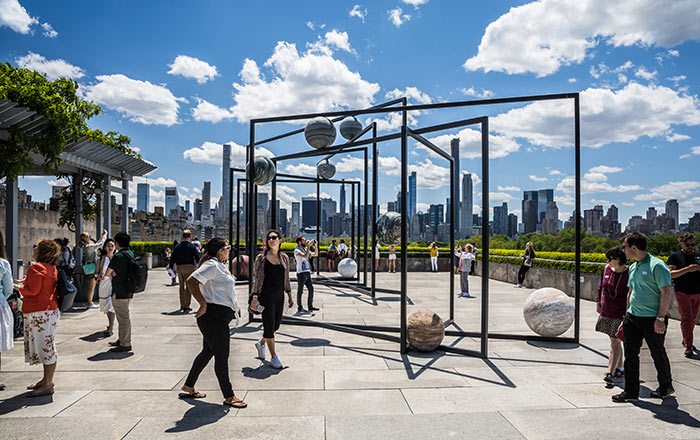 Alicja Kwade's Parapivot installation on the roof of The Met, with the New York City skyline in the background